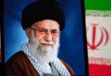 Successor Missing From Historic Funeral Portrait of a political leader with a black turban and glasses