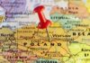 NATO Airspace Violated — What Crashed In Poland? Red pushpin marking Poland on a European map