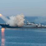 Warship launching a missile at sea