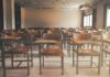 Parents Outraged: What Happened In These Classrooms? Empty classroom with rows of wooden desks and chairs