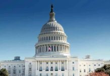 Congressman Defies Calls To Quit United States Capitol building with dome under clear blue sky
