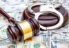 Fake Rehab Ring Stole Medicaid Billions Judge's gavel and handcuffs on pile of US dollar bills