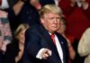 Trump Gives Iran Final Warning man in suit pointing toward the camera at an event