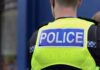 Roadside Bush Triggers Ticket Tsunami Police officer wearing a high-visibility vest