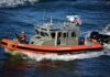 Beach Locked Down Over Fuel Fears U.S. Coast Guard patrol boat speeding on open water