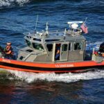 Beach Locked Down Over Fuel Fears U.S. Coast Guard patrol boat speeding on open water