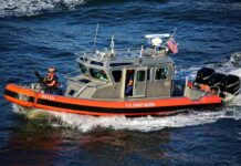Beach Locked Down Over Fuel Fears U.S. Coast Guard patrol boat speeding on open water