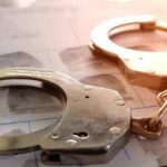 Voluntary Manslaughter At Age Twelve? Handcuffs on a fingerprint form