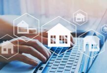 Hands typing on laptop with real estate house icons overlay