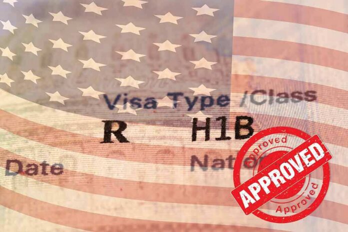 shutterstock_1822551422 H1B visa document with U.S. flag overlay and red Approved stamp
