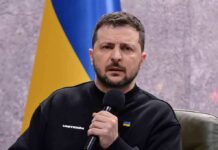 man holding a microphone during a talk