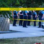 San Francisco Cops Launch Major Theft Crackdown police officers stand behind caution tape at a park scene