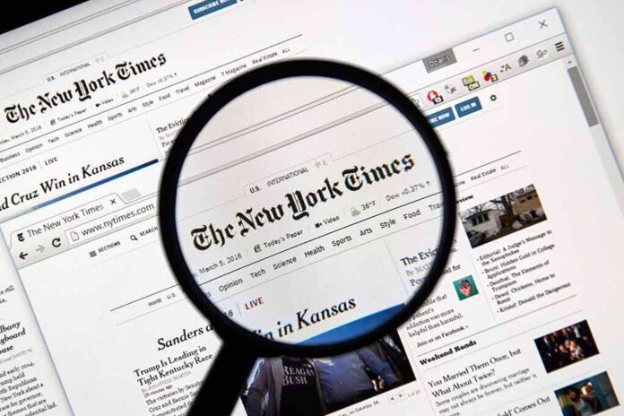 shutterstock_386787592 Magnifying glass over a newspaper website on a computer screen