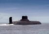 U.S. Strike Destroys One Of Iran’s Submarines Submarine cruising on calm sea