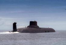 U.S. Strike Destroys One Of Iran’s Submarines Submarine cruising on calm sea