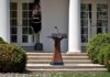 Podium with presidential seal in a garden colonnade