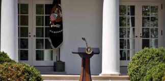 Podium with presidential seal in a garden colonnade