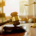 Parental Rights Clash Hits New Jersey Judge's gavel on a block with scales of justice in the background