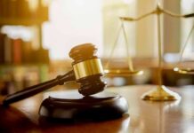 Parental Rights Clash Hits New Jersey Judge's gavel on a block with scales of justice in the background