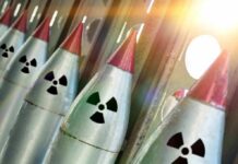 Contamination Concern Shuts Down Key Missile Tool Row of missiles with radiation symbols and red tips