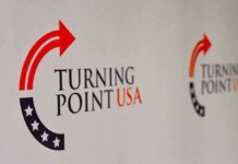 Turning Point USA logo on a backdrop