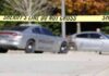 Workplace Shootout Shocks L.A. Care Home Sheriff's line tape blocking a street with police cars behind