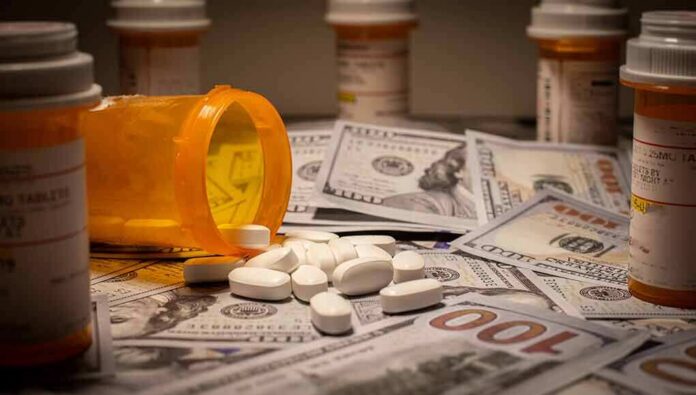 Prescription pill bottle and white tablets on scattered US dollar bills