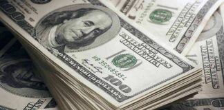 Stack of US 100 dollar bills