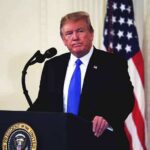 America Bets Big on Space Power man at podium with microphone and US flag