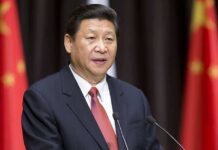 Xi’s Emergency Orders After Himalayan Horror A political leader delivering a speech at a podium with national flags in the background