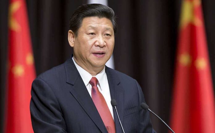 Moscow,,Russia,-,March,23:,Chinese,President,Xi,Jinping,Addresses A political leader delivering a speech at a podium with national flags in the background