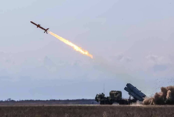 shutterstock_1361693690 Cruise missile launches from mobile launcher in open field
