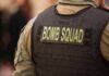 Bomb Squad Swarms Air Base Bomb squad officer wearing tactical vest