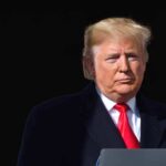 Trump Announces First GOP Midterm Convention Donald Trump at a podium with a microphone