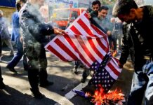 Trump Demands Trials Over Iran Crackdown people burning a U.S. flag on a city street
