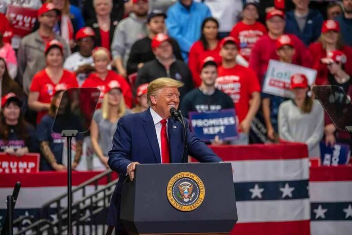 shutterstock_1789780022 speaker at podium addressing crowd at rally