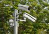 surveillance cameras mounted on a metal pole