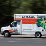 U-Haul moving truck driving on a road
