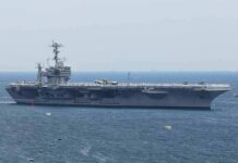Aircraft carrier sailing at sea