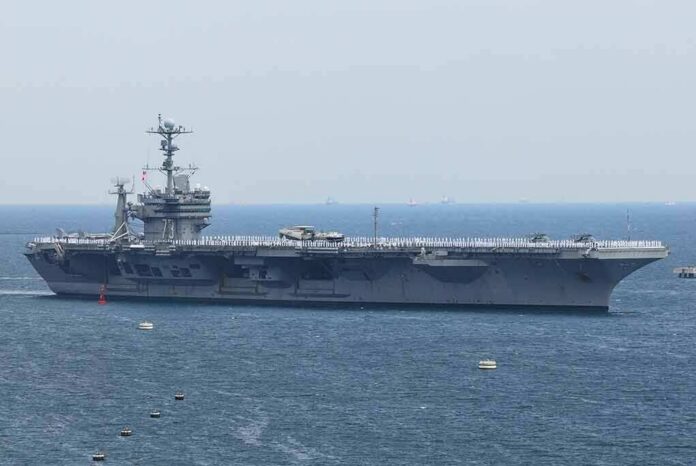 shutterstock_1984534982 Aircraft carrier sailing at sea