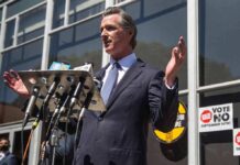 Newsom Just Supercharged DUI Penalties Gavin Newsom speaks at a press conference with microphones outside a building