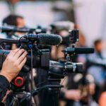 Mother Urges Child To Insult Trump Supporters Video cameras on tripods at a media event