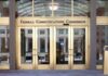 Federal Communications Commission building entrance with gold doors