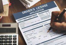 Driver's license application form being filled out by hand