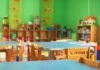 Ghost Daycares Drain Millions Preschool classroom with small tables and wooden chairs