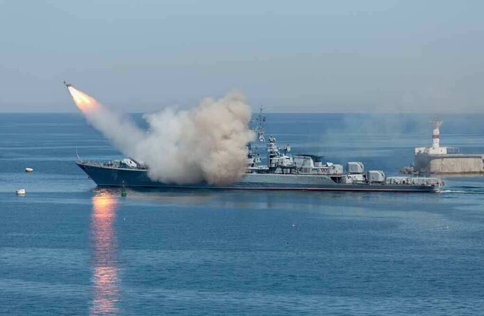 Warship launching a missile at sea
