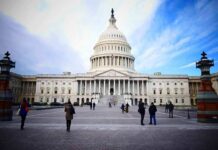 Day One Drama Teased By Democrats United States Capitol building with visitors on the plaza