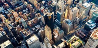 Aerial view of dense downtown skyscrapers at sunset