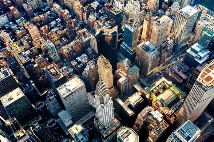 shutterstock_648271795 Aerial view of dense downtown skyscrapers at sunset