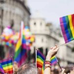Pride flags waved at a city parade